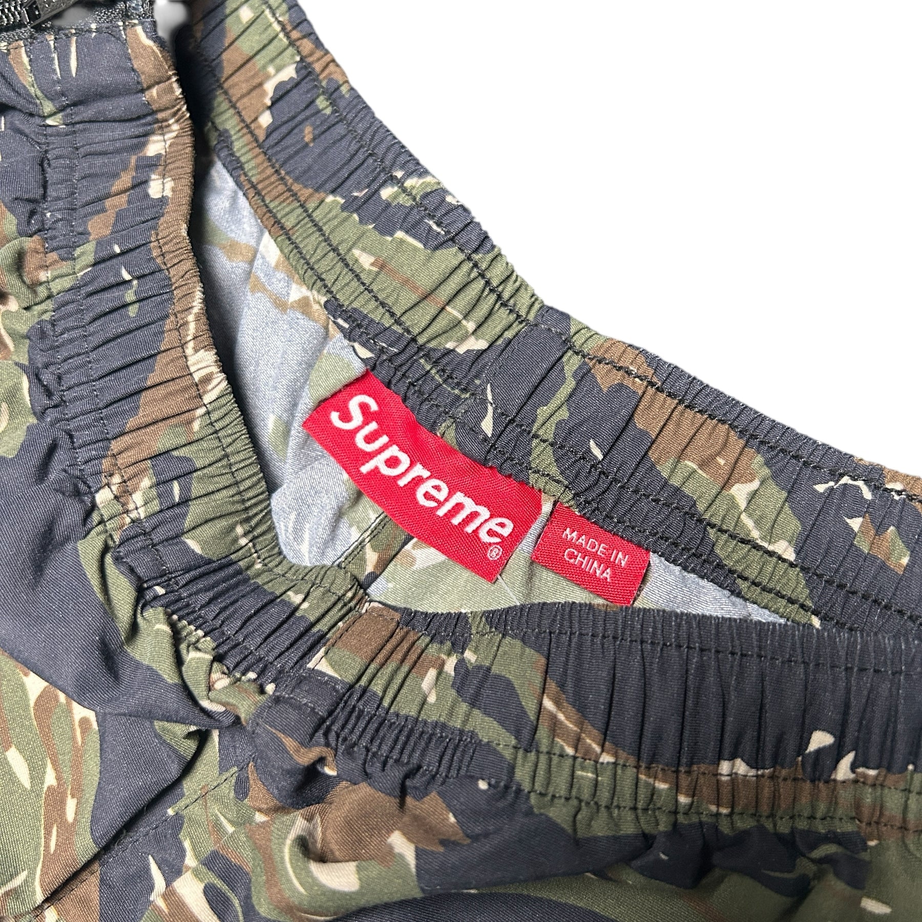 SUPREME WOVEN TRACK BOTTOMS