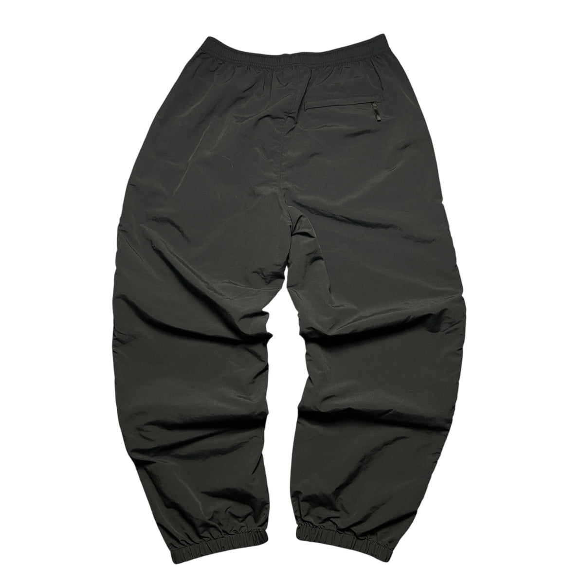 SUPREME WOVEN TRACK BOTTOMS