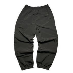 SUPREME WOVEN TRACK BOTTOMS