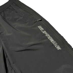 SUPREME WOVEN TRACK BOTTOMS