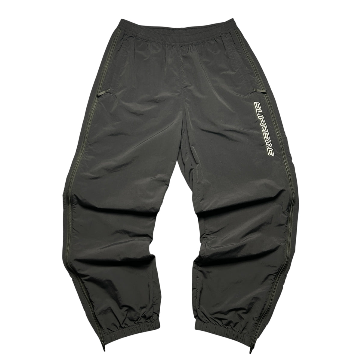 SUPREME WOVEN TRACK BOTTOMS