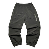 SUPREME WOVEN TRACK BOTTOMS